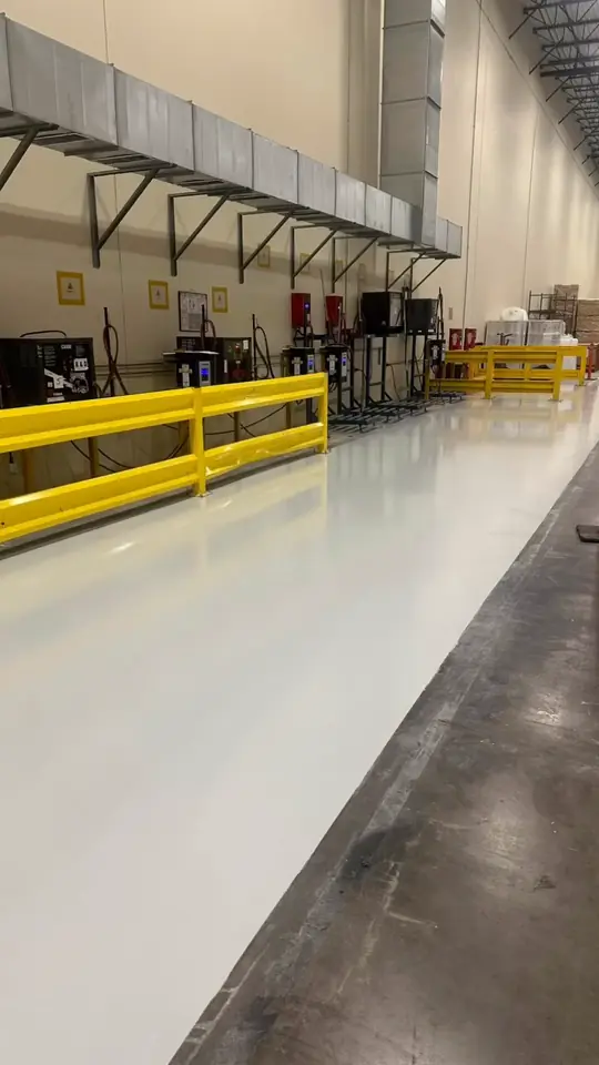 Before and after of a commercial warehouse floor coating in Arlington, TX, with forklift aisles and safety rails, a Flooring Contractor Arlington project