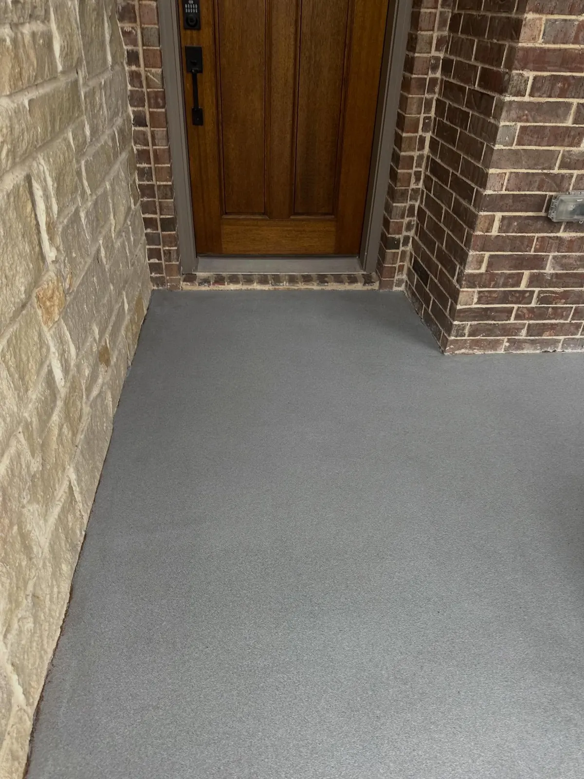 Front entry with new gray flake resin floor coating in Arlington, TX, a Flooring Contractor Arlington project
