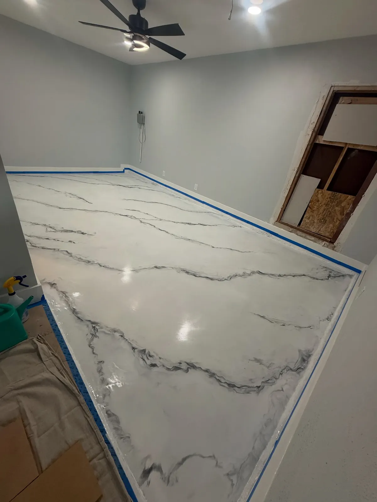 White metallic marble epoxy floor with gray veining in a large room, a Flooring Contractor Arlington project